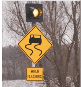 Slippery Road Sign USA Advisory messaging and warning flashers for the study (1)